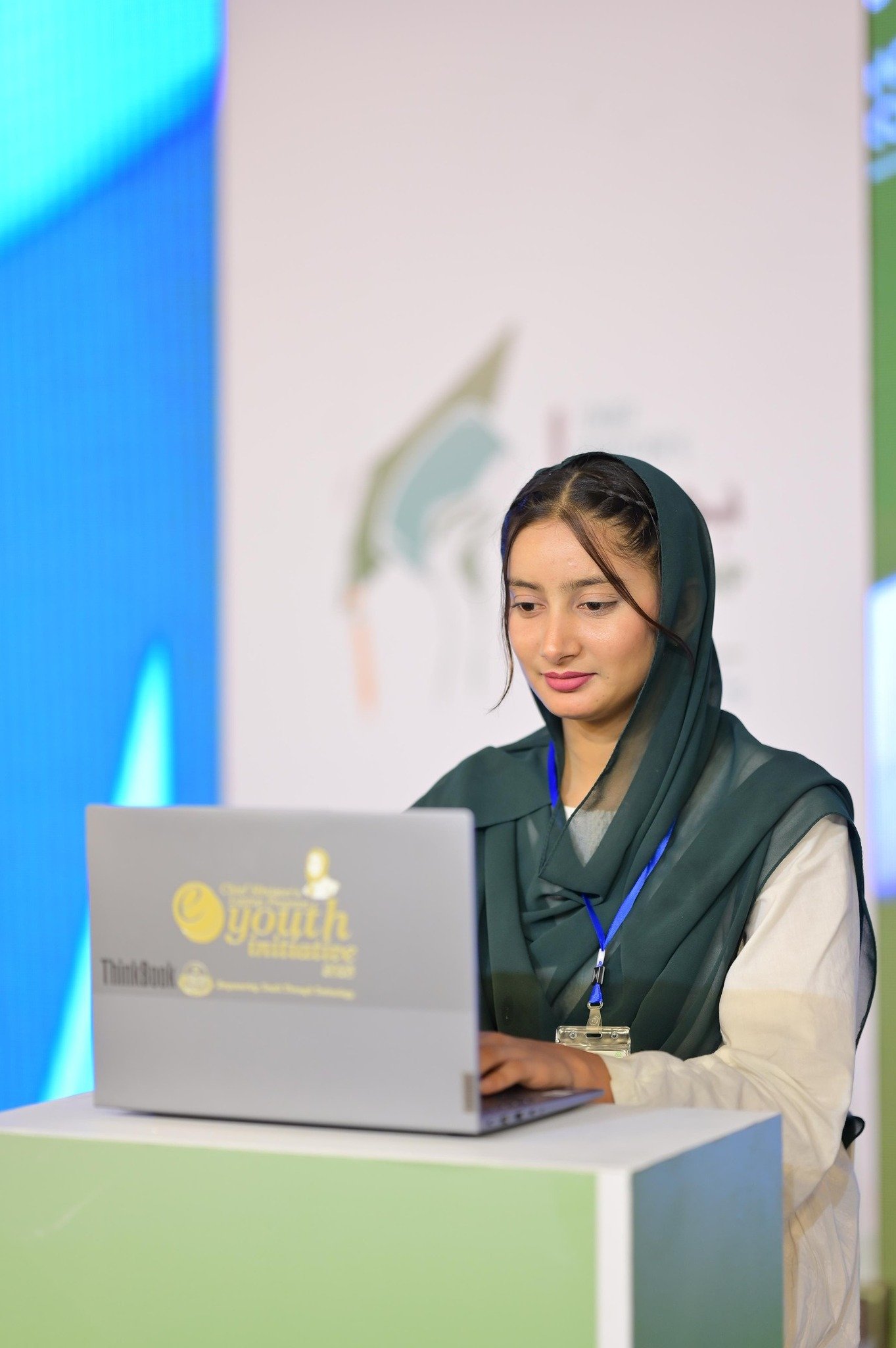 A student with her new laptop at the ceremony