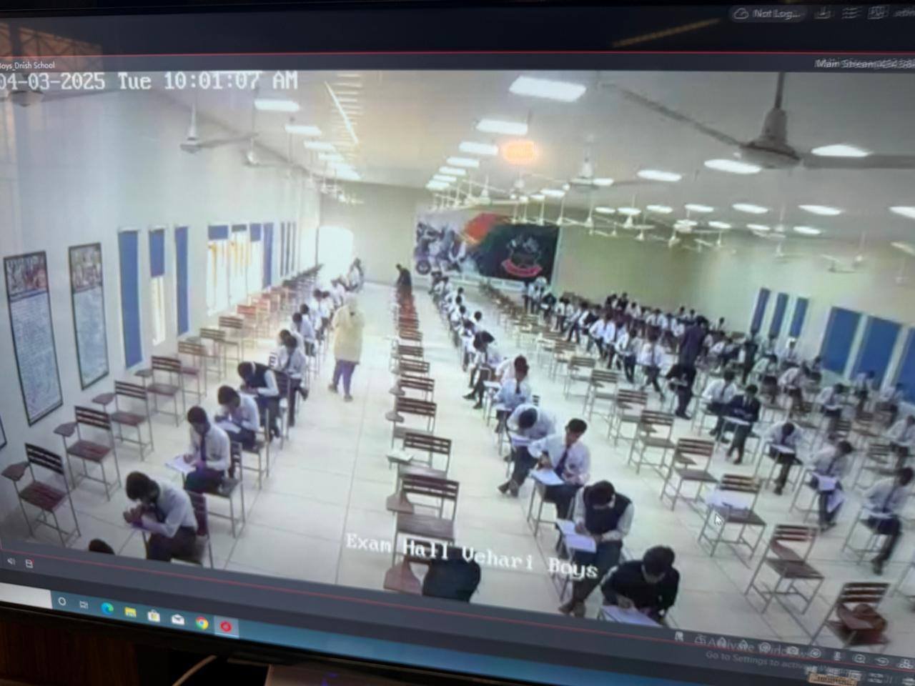 Examination hall with students seated at desks